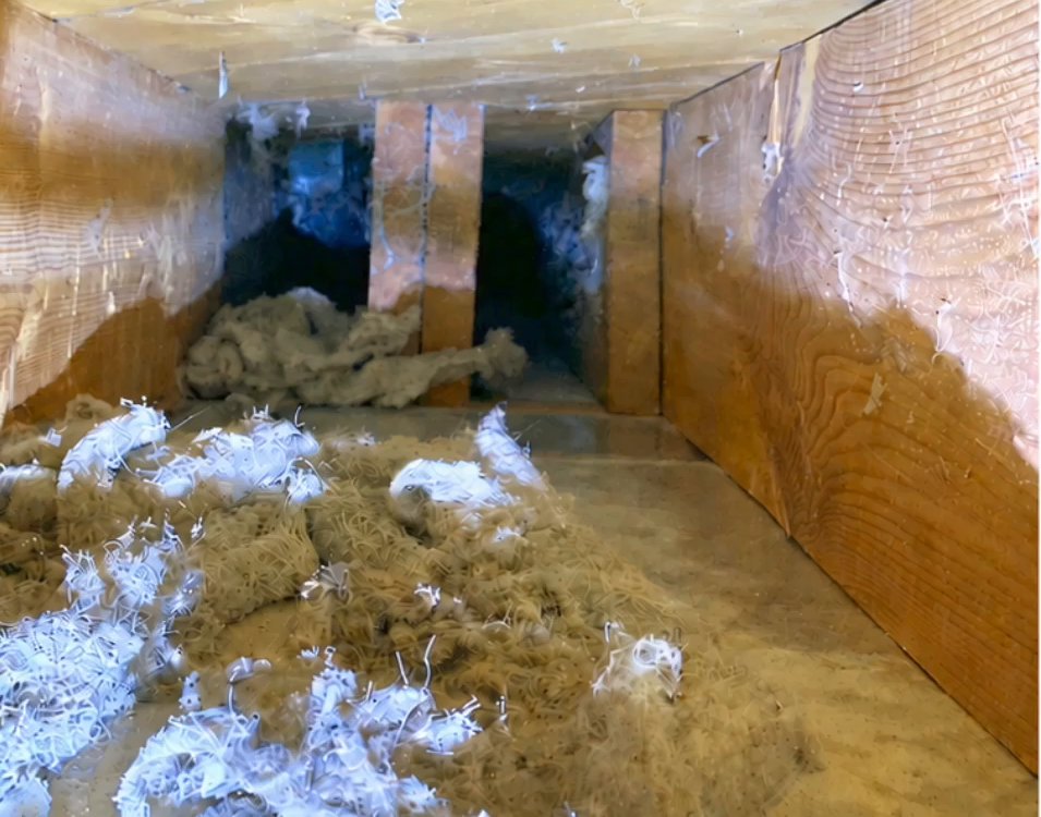 Air duct full of dust and debris before cleaning