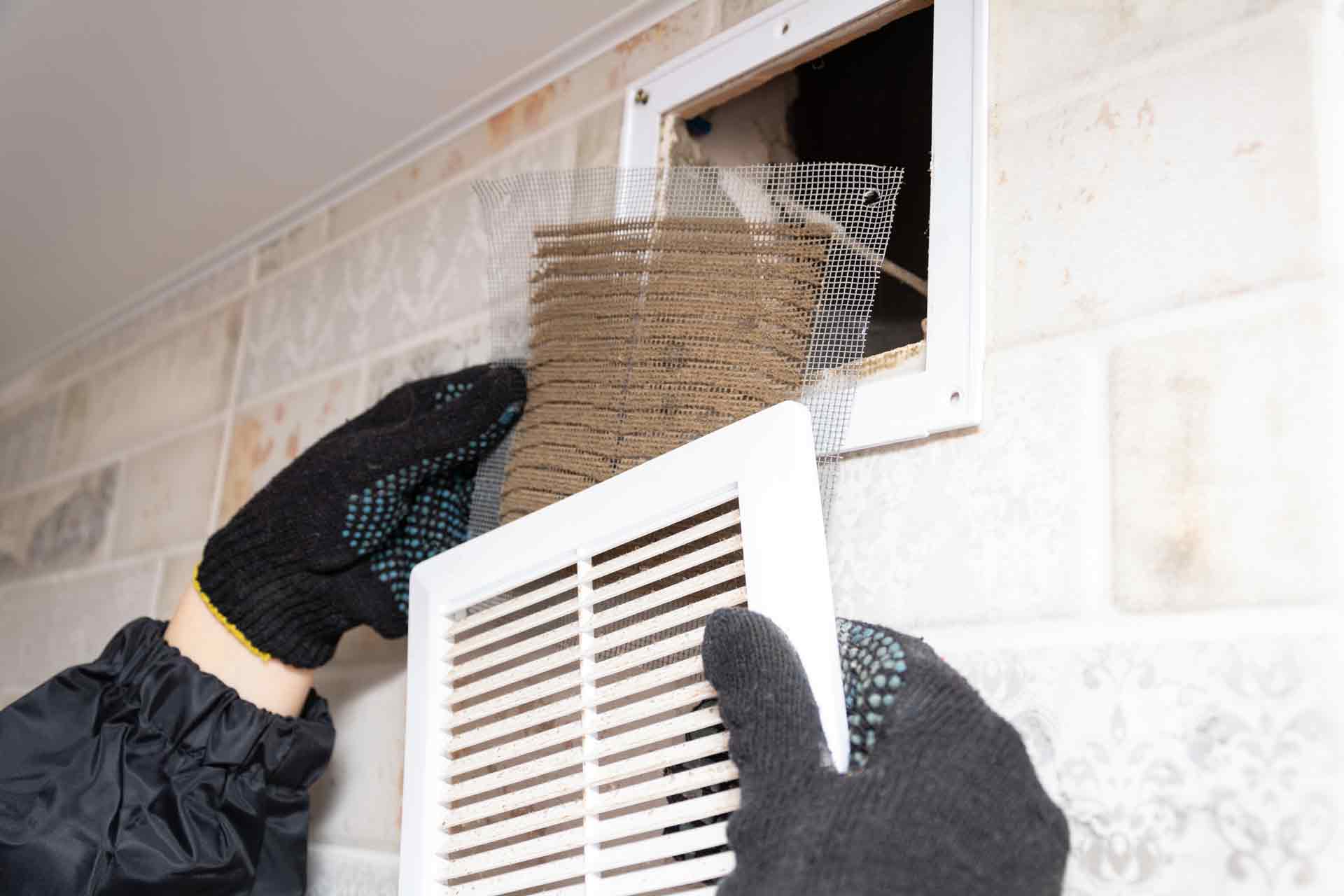 Denver Pros technician performing air duct cleaning in Centennial, CO