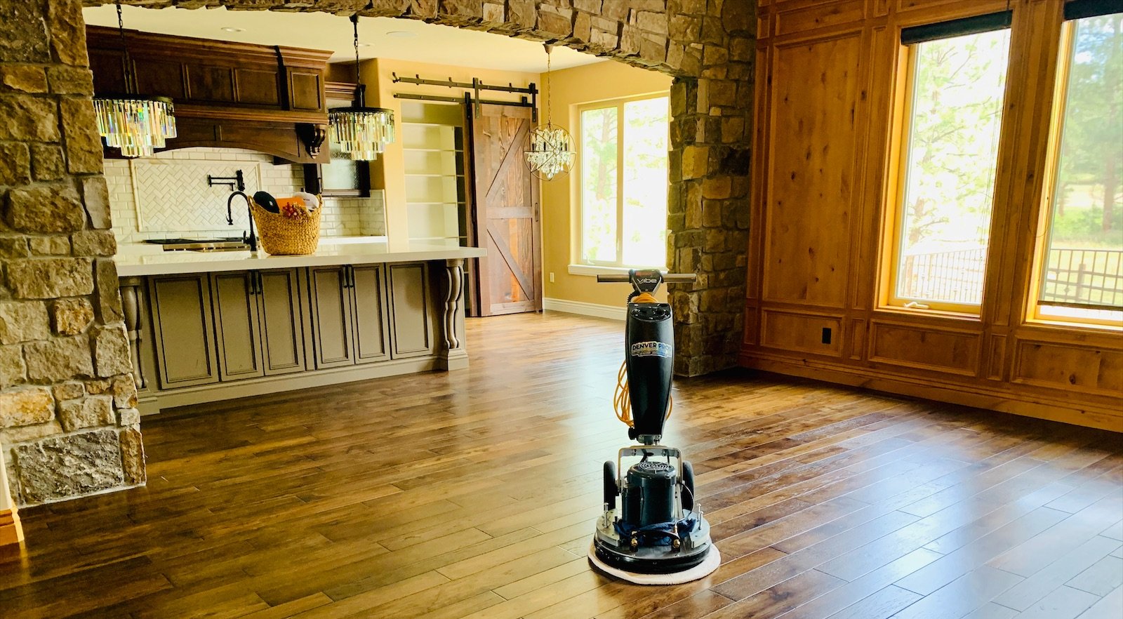Denver Pros floor buffer on freshly cleaned and buffed hardwood floors in a Denver Metro home