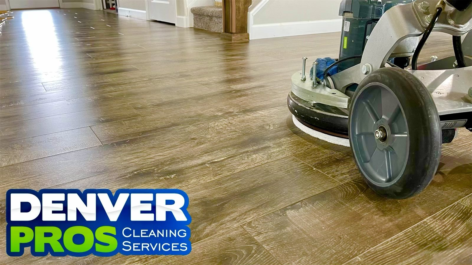 Denver Pros deep cleaning a hardwood floor with commercial-grade equipment