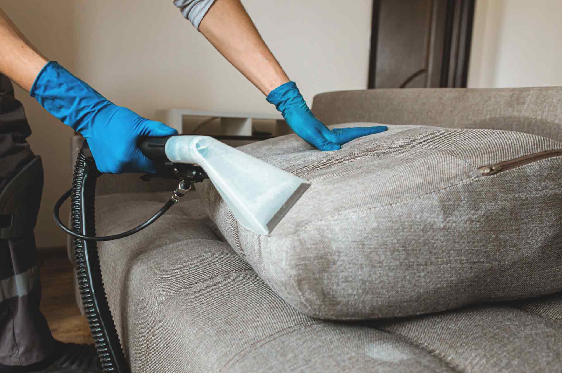 Denver Pros upholstery cleaning a sofa in Aurora, CO