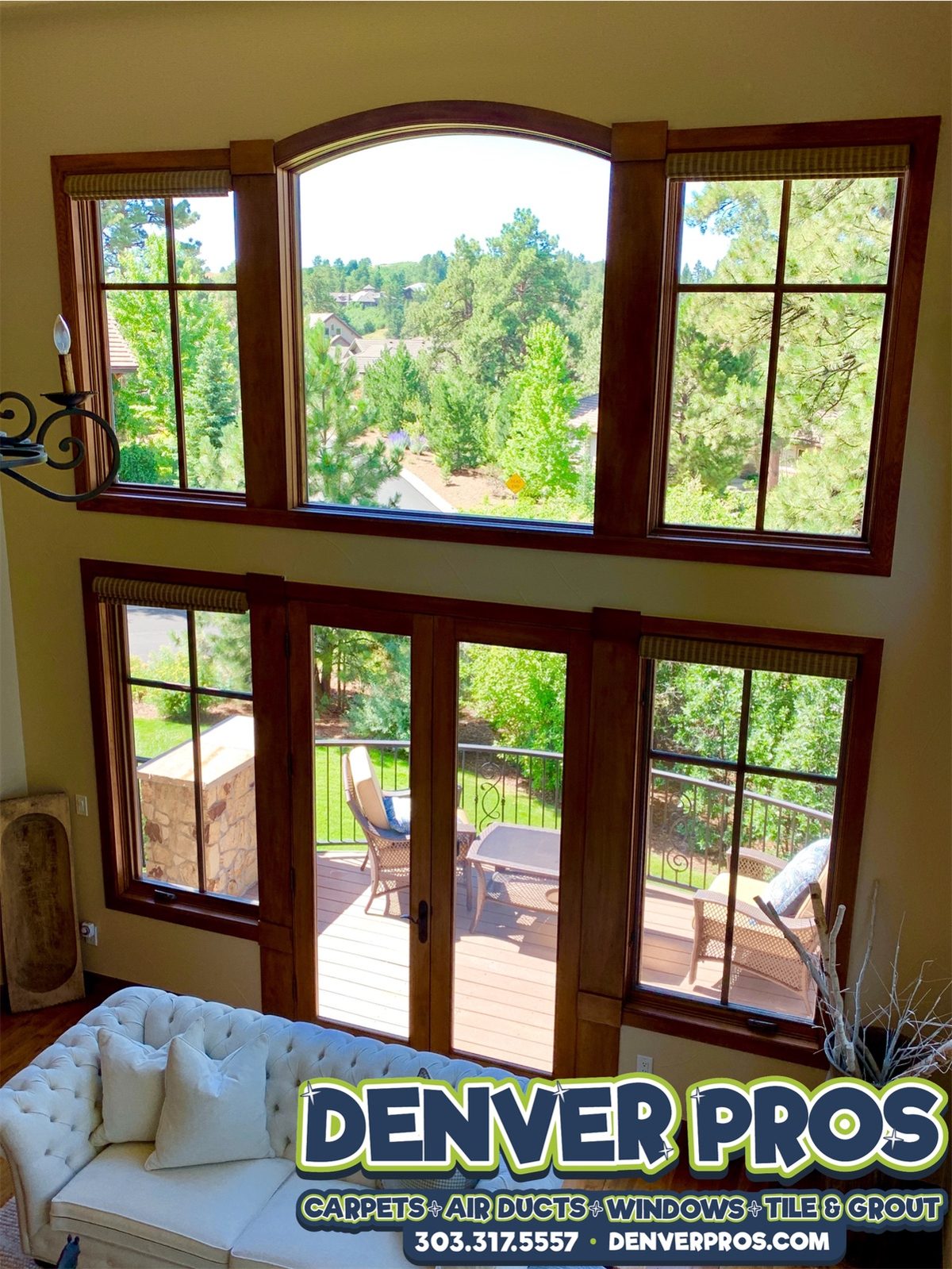 Two-story living room windows and patio doors cleaned by Denver Pros